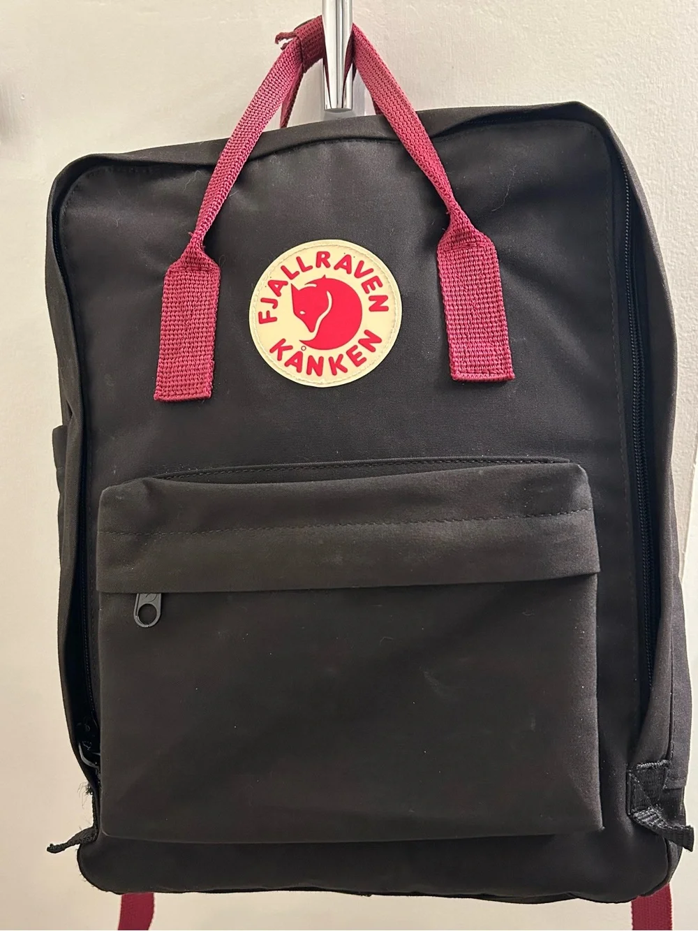 Fjallraven Black Backpack with Red Handles